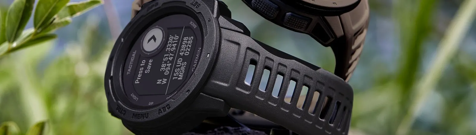 My Love Hate For The Garmin Instinct Tactical: An Unbiased Review 9 garmin instinct tacticals stacked on t op of each other on a rock for display