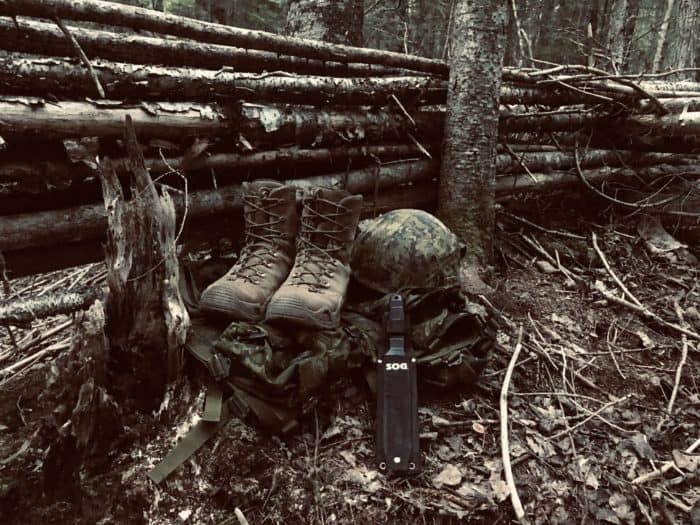 LOWA Z-8S tactical boots displayed in the woods with Canadian military apparel and the SOG SEAL Team Elite knife