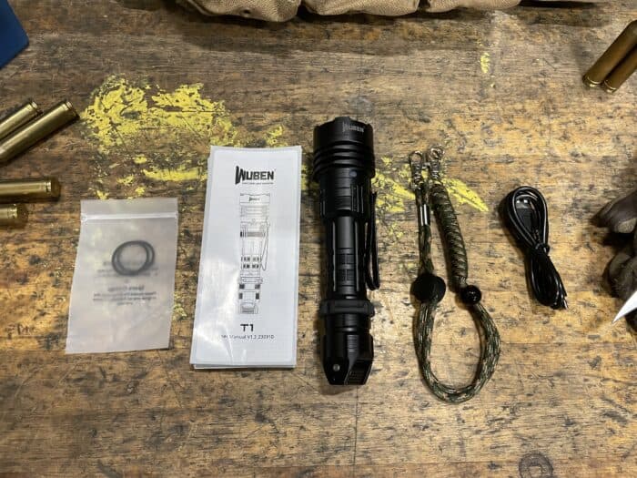 Wuben T1 Review: Is It The Best Tactical Flashlight? 7 The Wuben T1 Tactical Flashlight and everything that comes in the box with, instructions, two more rubber washers, a wrist lanyard, and a charging cable