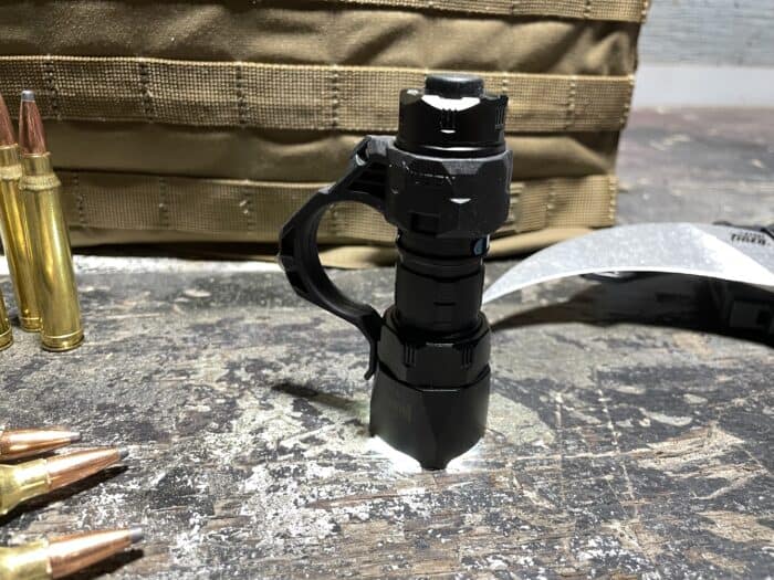 Wuben T4 Review: The Newest Tactical Flashlight in Wubens Arsenal 26 THE WUBEN T4 TACTICAL FLASHLIGHT, standing infront of the 5.11 tactec plate carrier