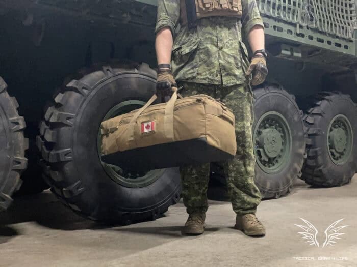 Condor Colossus Duffel Bag Review: Like a Military Duffel, Just Better! 29 the Condor Colossus duffle bag being carried with the main handle