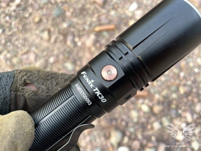Fenix TK30 Tactical Flashlight Review: Lasers, Great For Self Defence 11 The Fenix TK30 Tactical Flashlight has button on the side that switches between two brightness levels
