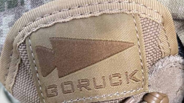 the GORUCK MACV-2 has an extremely thing tongue whos only purpose is to prevent things from falling into your boots