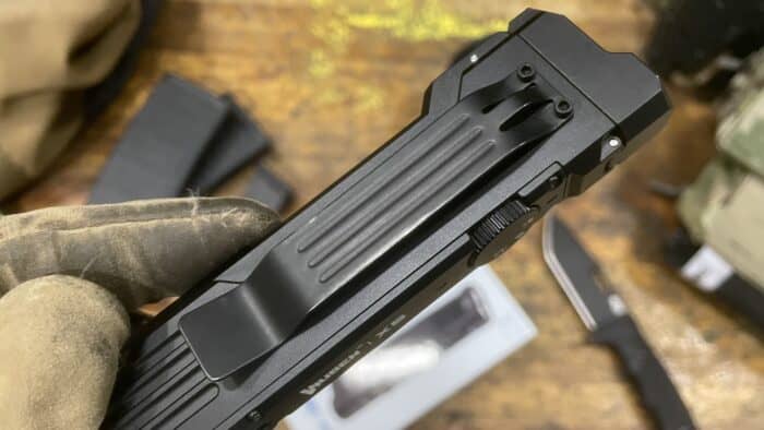 The x5 has a wide, flat, low profilw belt clips that holds tight and stays out of the way